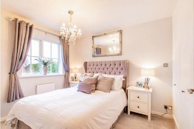 Upstairs are three good sized bedrooms. The master bedroom is decorated in muted purples and creams, creating a warm, relaxing space.