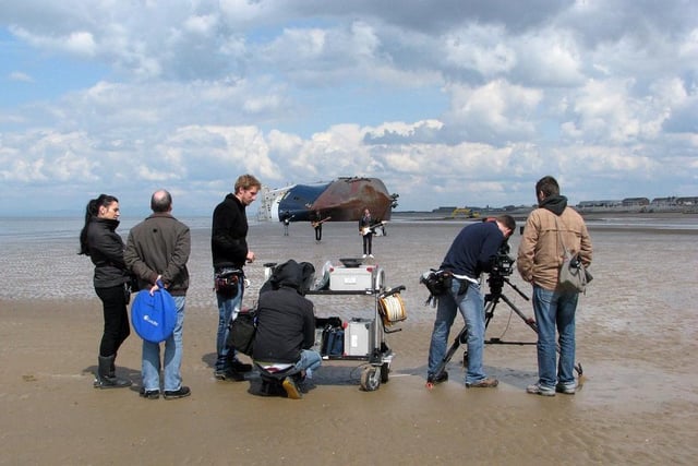 The production crew with all their gear on the sands film German band Fotos music video