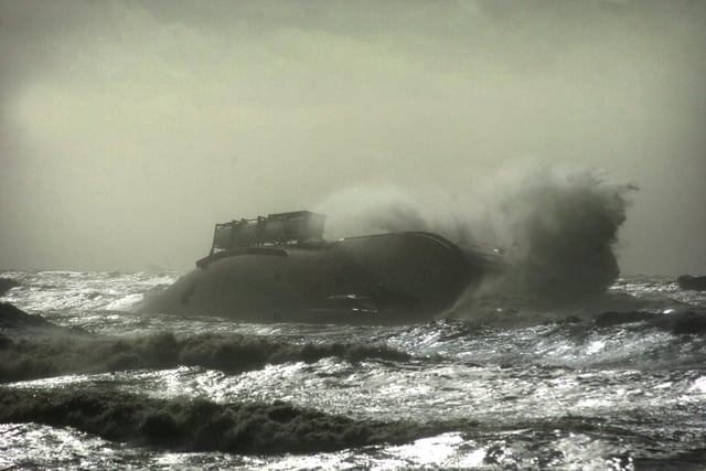 The stricken ferry takes a battering from the waves