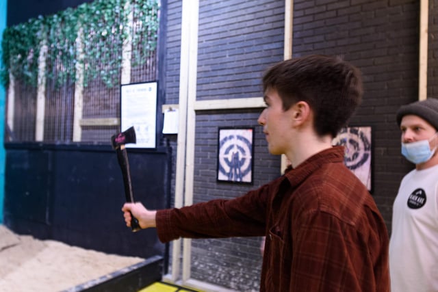 The first visitors throw axes at Black Axe Throwing Co at the Kanteeen in Lancaster. Photo: Kelvin Stuttard