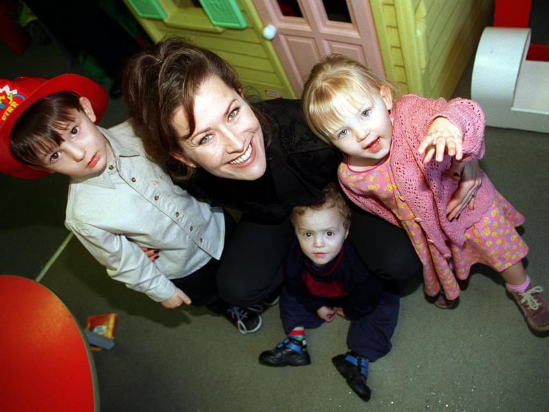 Actress Kazia Pelka, nurse Maggie Bolton from TV's Heartbeat, was at the NCH Action For Children's Broom Hill Family Centre in Harehills to receive a £53,000 cheque on behalf of the charity from Marks and Spencer. She is pictured with three of the children at the Centre, from left, Dillon Bown, Ryan Slattery and Zoe Bown.