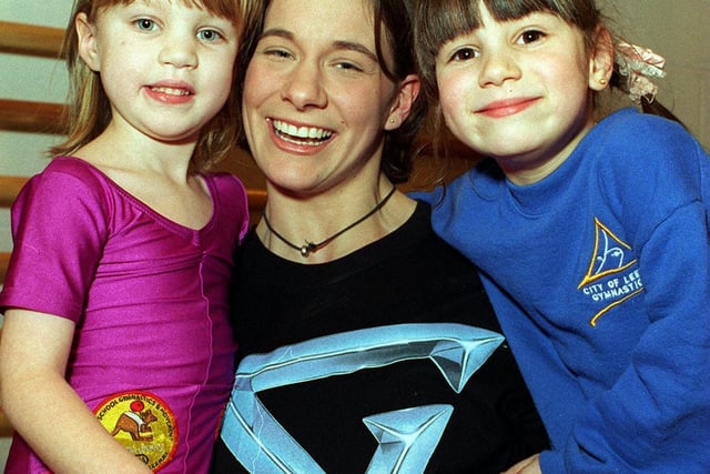 This is Kerryn Sampey, champion of the Gladiators Ashes series in 1995. She is pictured giving two young gymnasts - Alice Wilkins (left) and Angela Shanks - a lift at Leeds Carnegie College in February 1996.