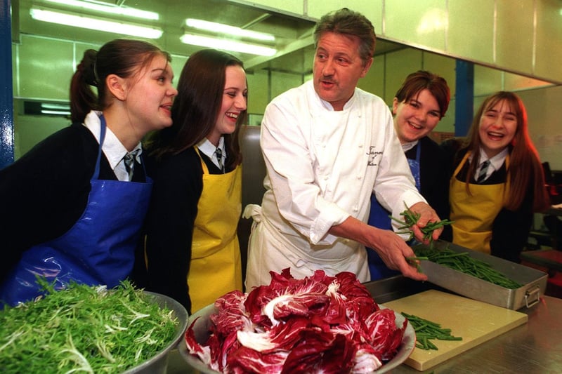 The celebrity chef returned to his former school, Morley High, in February 1999. He is pictured helping pupils - Nicola Dodson, Rachel Flather, Charlotte Stone and Helen Batty - prepare a dinner celebrating the opening of the school's new building.