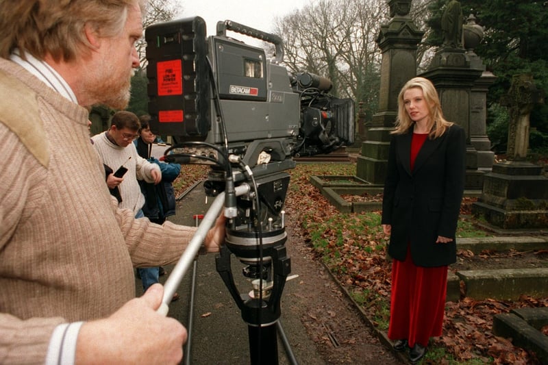 This is actress Saskia Wickham, best known for her roles in Boon and Peak Practice, who was in Leeds to film BBC's Songs of Praise in March 1996. She is pictured with the film crew at Lawnswood Cemetery.