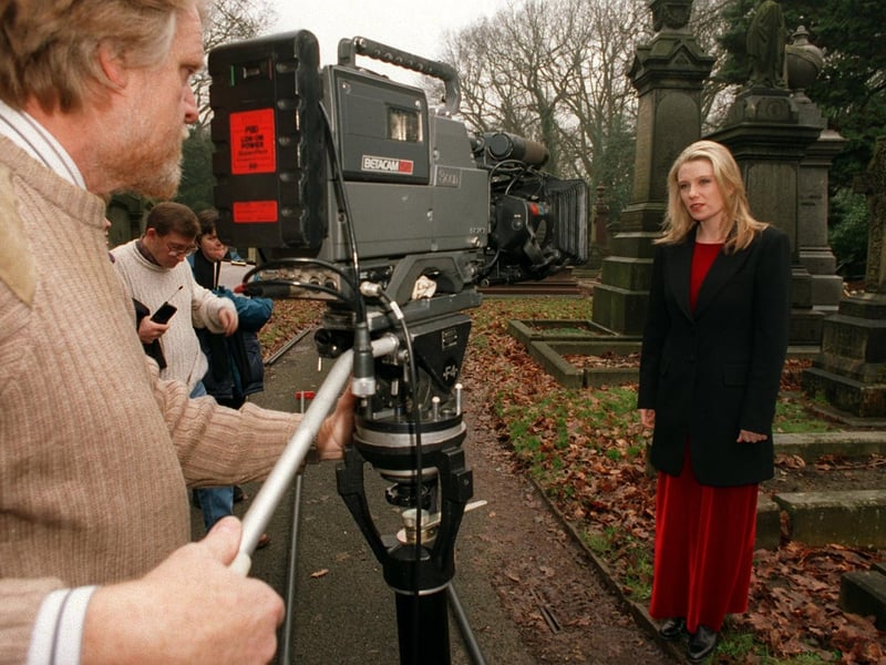 This is actress Saskia Wickham, best known for her roles in Boon and Peak Practice, who was in Leeds to film BBC's Songs of Praise in March 1996. She is pictured with the film crew at Lawnswood Cemetery.