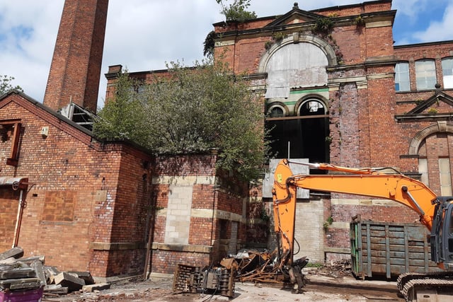 A section of the listed Eckersley Mill site being demolished, off Swan Meadow Road, Wigan - May 2021.
