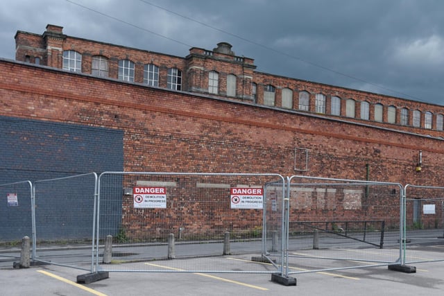 Scene at Pottery Terrace, Wigan - part of the wall to Eckersley Mill has collapsed and the road is closed off as it is dangerous - June 2019.