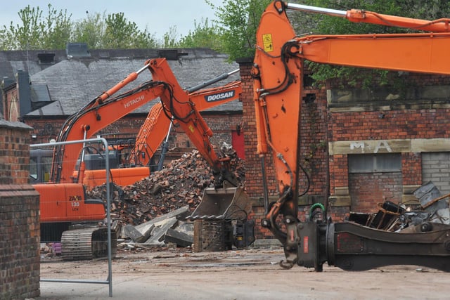 A section of the listed Eckersley Mill site being demolished, off Swan Meadow Road, Wigan - May 2021.