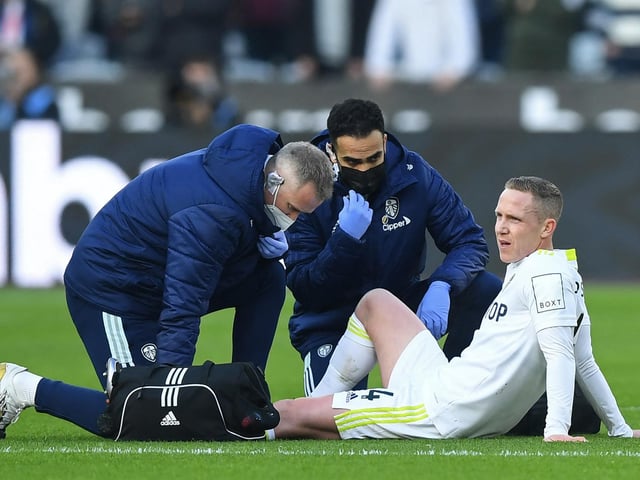Adam Forshaw goes down with an injury.
