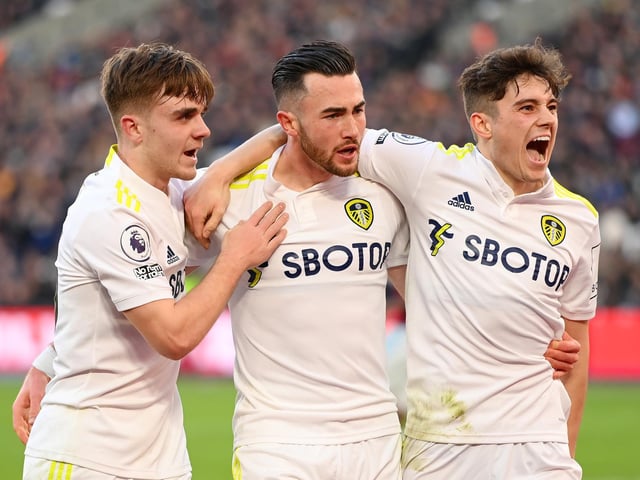 Lewis Bate and Dan James celebrate with the Whites' hat-trick hero after Jack Harrison gives Leeds the lead again in the 59th minute.