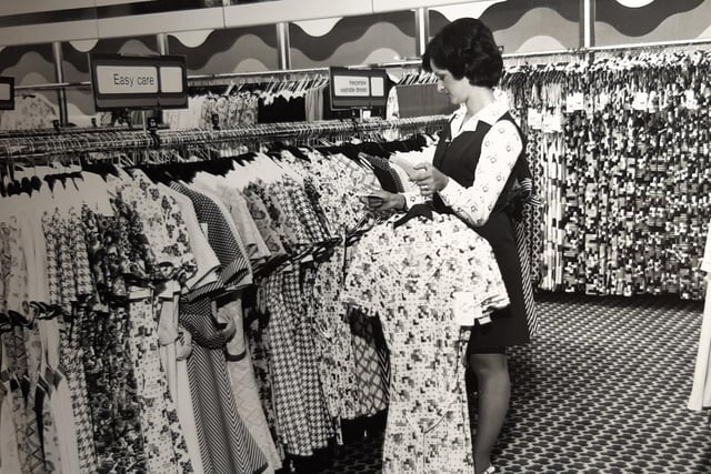 Liz Conway organising stock on the upper sales floor at C&A in July 1974
