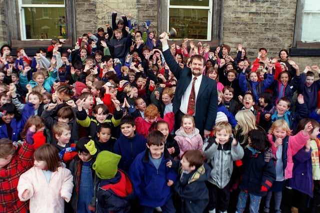 Headingley Primary headteacher Frank Sheldrick with his pupils in December 1999. The school came out joint second in top performers in the country.