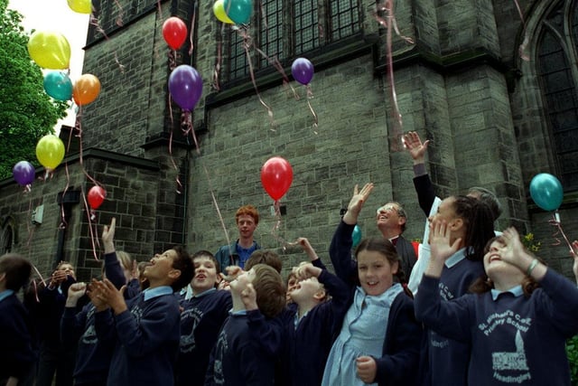 Children from St Michaels C of E Primary let go of balloons in front of St. Michael's  Church in September 1998 to mark the launch of a public appeal to restore the church's roof.