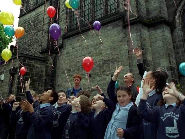 Children from St Michaels C of E Primary let go of balloons in front of St. Michael's Church in September 1998 to mark the launch of a public appeal to restore the church's roof.