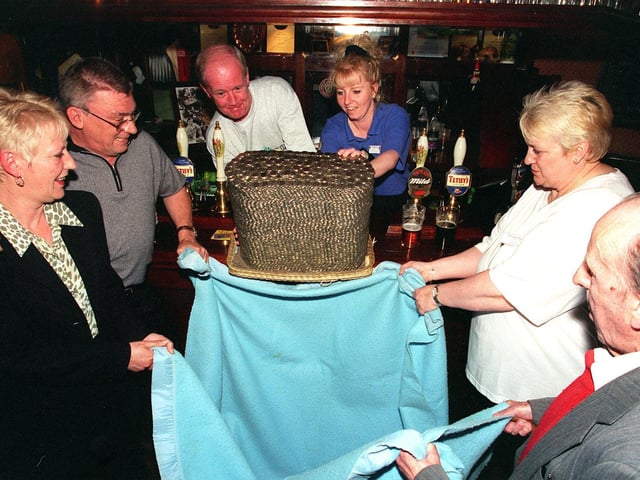 A pile of 10 pence pieces and £1 coins raised for Wheatfields Hospice are demolished at The Three Horse Shoes in Headingley in May 1999. Pictured, from left, are publicans Lesley and Trevor Hodgson, regular Michael McMillan Beverley Dickinson from Wheatfields, Irene Moran from Wheatfields and oldest regular Jack Clark.