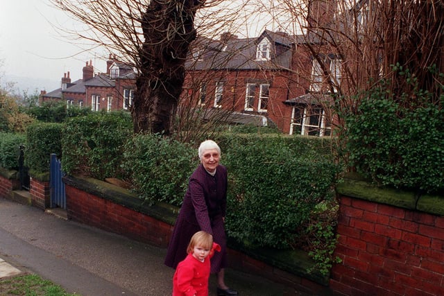 This is Christine Fenton of Woodland Park Road who was leaving the street after 45 years. She is pictured the street's youngest resident Amy London.