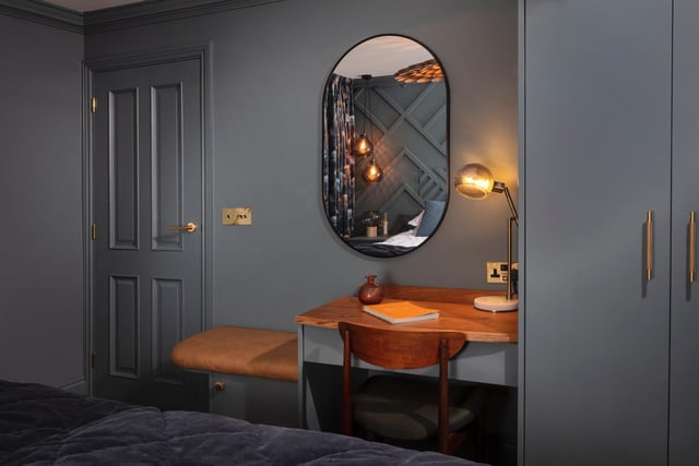 The mirror helps add depth and a feeling of space to the room