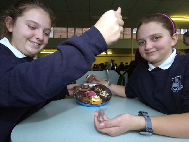 Evie Headlan and Courtney Reid of Eskdale School organise a bun sale to raise funds for Haiti.