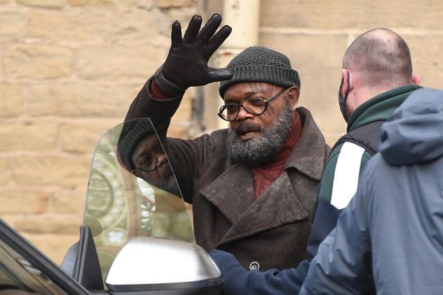 Samuel L Jackson gets into a car after filming  for Secret Invasion at The Piece Hall in Halifax
