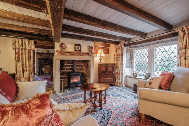 A light yet cosy sitting room with a focal fireplace. (Photo: David Thornton)