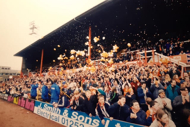 Looks like a full celebration here with tangerine coloured balloons - are you a face in the crowds? What was happening?