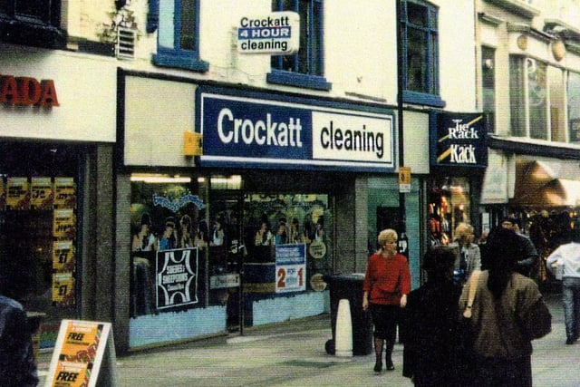 Commercial Street in Leeds city centre showing Crockatt Dry Cleaners and Tie Rack. On the left is Granada TV & Video.