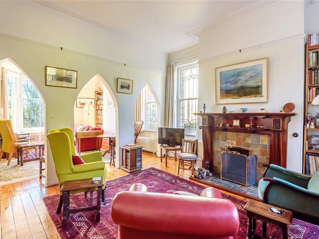 There are two reception areas in the property. They separated from each other by three ecclesiastical style openings.