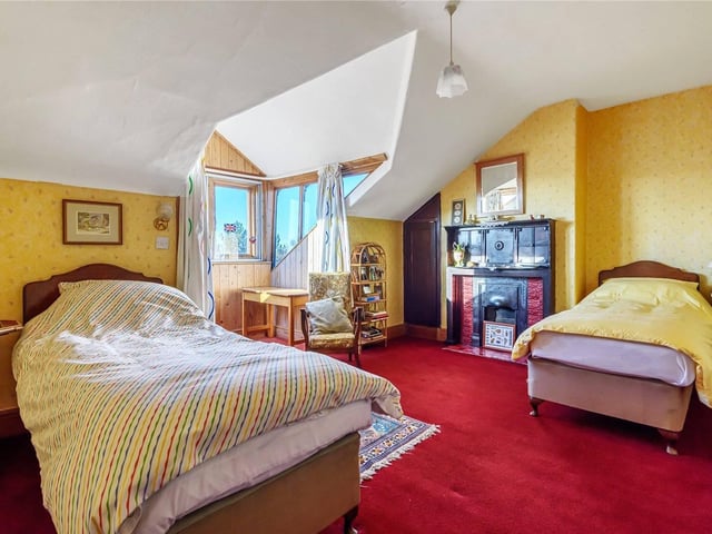 An example of the other bedrooms. This one has a beautiful feature fireplace.