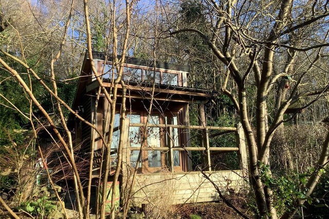 At the end of the garden is a stylish wooden summerhouse. It has mains water and power, and a phone line connection for WIFI, so would make an idea home office.