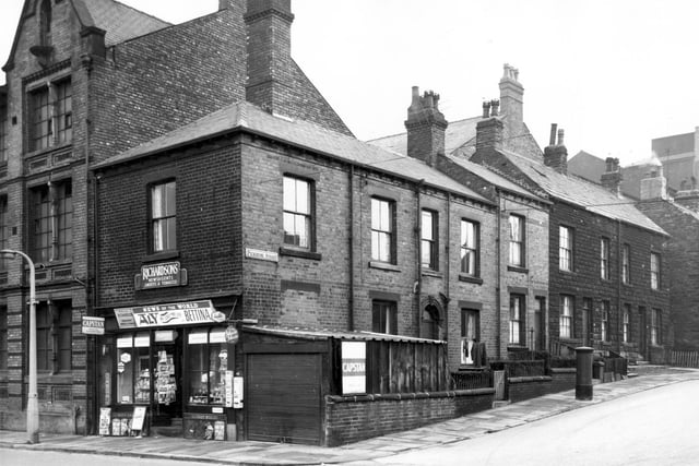 Canal Road at the junction with Pickering Street in February 1964 showing the corner premises of W.R. Richardsons newsagent. The shop is adjacent to Carlton Works seen far left.