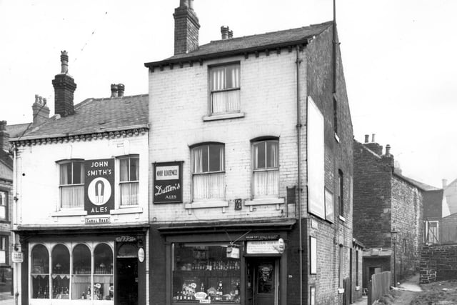 Two off licences located side-by-side on Canal Road in February 1964. On the left is Herbert Steeles and William Toft's. Far left, part of Pickering Street can be glimpsed and Delph Hill is on the right.