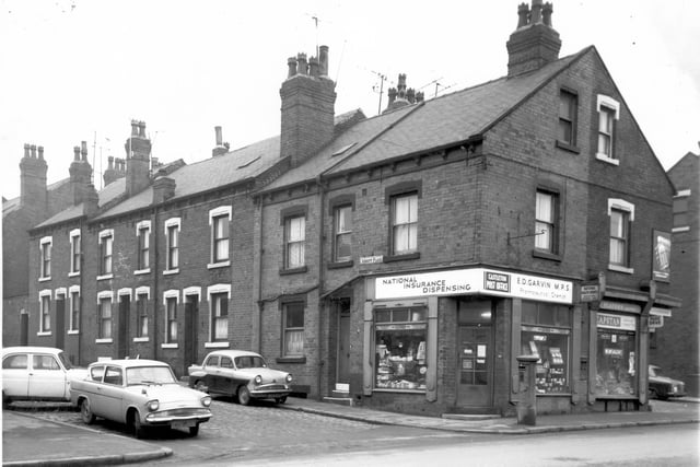Back-to-back terraces on Abbott Place off Armley Road in February 1968.
On the corner a letter box stands outside the Castleton Post Office also the National Insurance dispensing chemist run by E.D. Garvin M.P.S. To the right of this is D & M Darbishire newsagents.