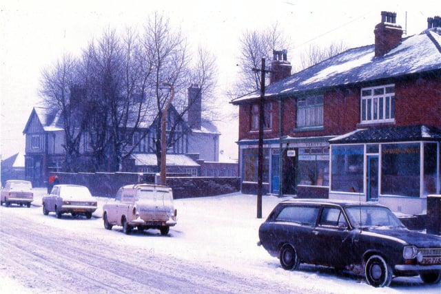 Cockshott Lane covered in snow in February 1969. The Wyther Hotel can be seen to the left then to the right a parade of shops with Verity's newsagents in the centre and a fish and chip shop on the left of Verity's.