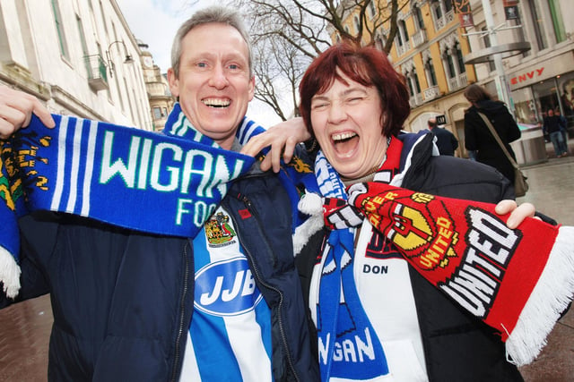 Latics Fan Steve Siddall and his partner and Man Utd supporter Karen Ross at the Carling Cup Final between Wigan Athletic and Manchester United at the Millennium Stadium, Cardiff, on Sunday 26th of February 2006.