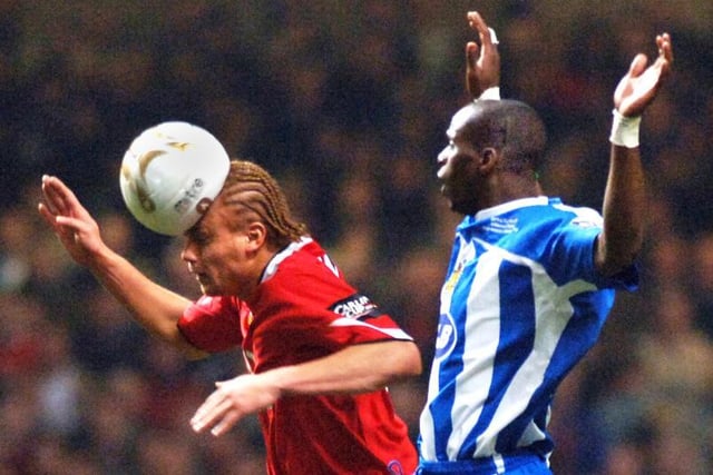 Henri Camara holds his hands up as Wes Brown appears to flatten the ball with a header in the Carling Cup Final between Wigan Athletic and Manchester United at the Millennium Stadium, Cardiff, on Sunday 26th of February 2006.
Latics lost 0-4.