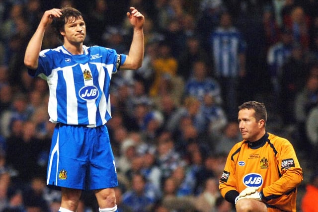Skipper Arjan de Zeeuw and goalkeeper John Filan can't believe it as Wayne Rooney scores the fourth goal in the Carling Cup Final between Wigan Athletic and Manchester United at the Millennium Stadium, Cardiff, on Sunday 26th of February 2006.