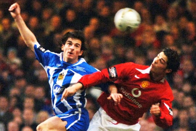 Leighton Baines battles against Cristiano Ronaldo in the Carling Cup Final between Wigan Athletic and Manchester United at the Millennium Stadium, Cardiff.