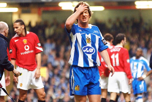 Leighton Baines shows the pain of defeat at the end of the Carling Cup Final between Wigan Athletic and Manchester United at the Millennium Stadium, Cardiff, on Sunday 26th of February 2006.