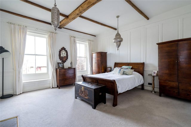 To the first floor is the master bedroom, a magnificent room with plenty of space, feature beams and views across the grounds.