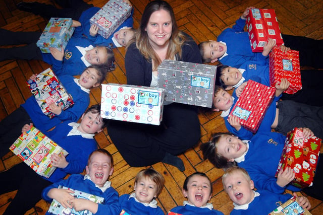 Gladstone Road School pupils celebrate the success of their Christmas Shoebox Appeal with teacher Kate Middleton.