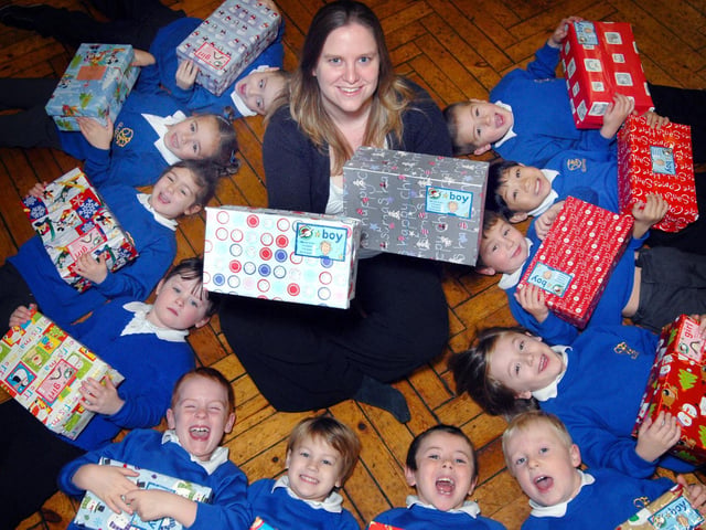 Gladstone Road School pupils celebrate the success of their Christmas Shoebox Appeal with teacher Kate Middleton.