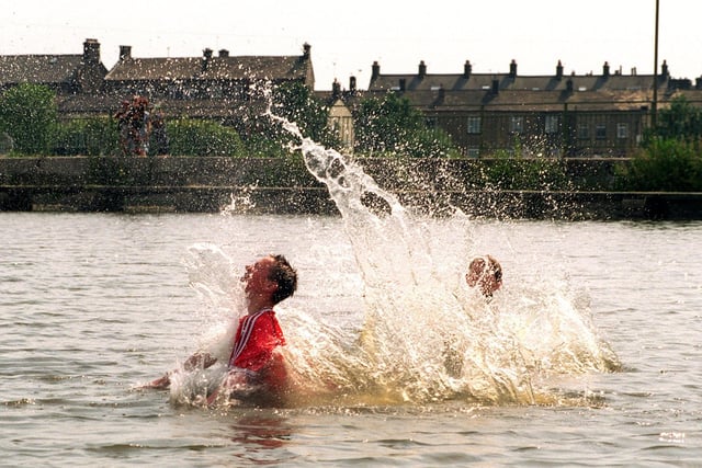 Teenagers Steven Atkins and Andrew Nutter keep cool as they make a splash in Yeadon Tarn.