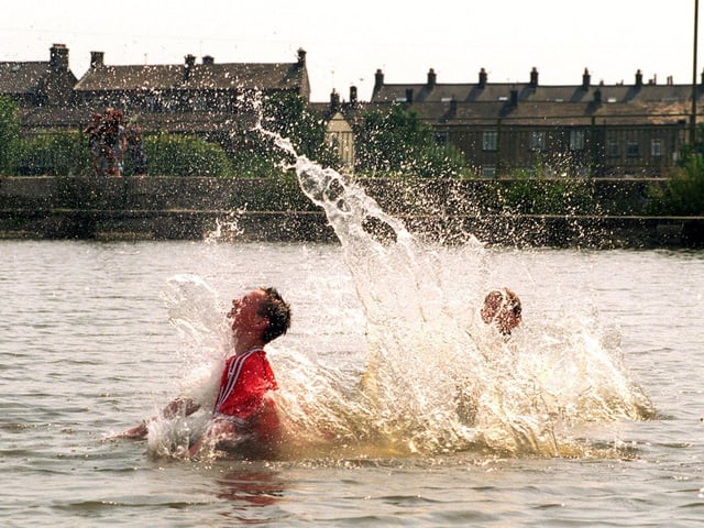 Teenagers Steven Atkins and Andrew Nutter keep cool as they make a splash in Yeadon Tarn.