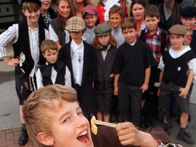 Ben Randles who played Oliver in the Rawdon Amataur Dramatics production, tucks into free fish and chips watched by the rest of the cast at Murgatroyds.