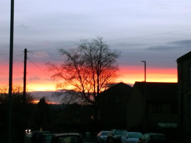 Colourful early morning sunrise, looking from Carlinghow Lane over towards Morley, by John Duke