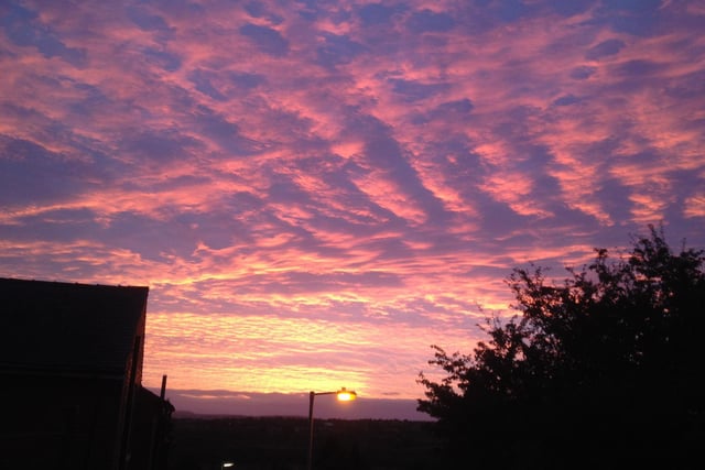Sunset over Mirfield by Mike Hobson