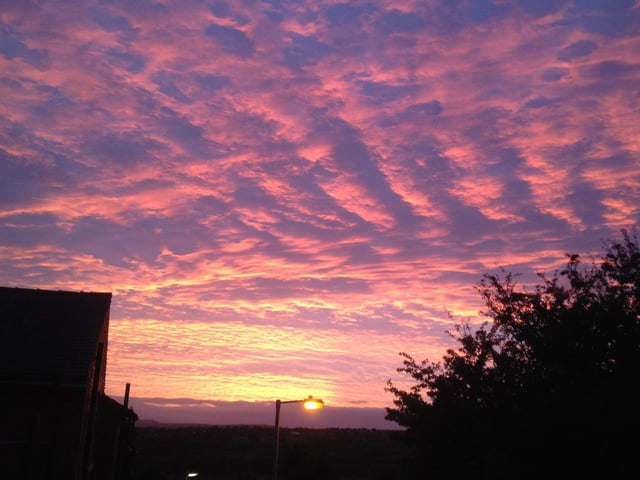 Sunset over Mirfield by Mike Hobson