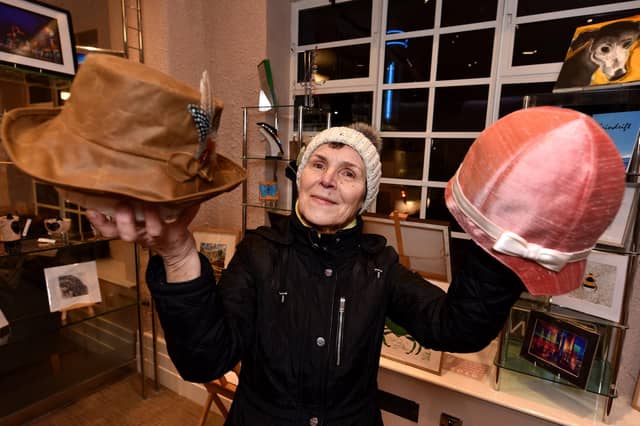 Elena Tradewell makes hats and is one of scores of crafers and artists who use the shop in the theatre foyer to showcase their work