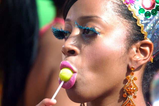 Leeds West Indian Carnival, pictured is a dancer enjoying a lollypop before the start of the carnival (Date: 30 August 2010).