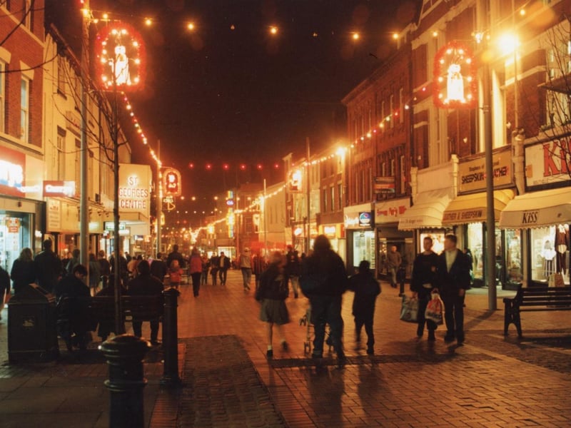 Christmas shopping in Friargate, Preston. This image was captured in 1994. None of the shops you see here are still on the high street today.